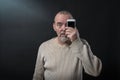 Man does not understand his smart phone Royalty Free Stock Photo