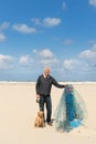 Man with dog at the beach Royalty Free Stock Photo