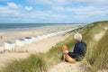 Man with dog at the beach Royalty Free Stock Photo