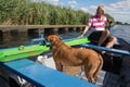 Man with dog in the boat Royalty Free Stock Photo