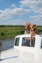 Man and dog in boat Royalty Free Stock Photo