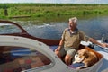 Man and dog in boat Royalty Free Stock Photo