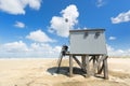 Man and dog at drowning house at the beach Royalty Free Stock Photo