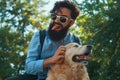 Man and dog having fun, playing, making funny faces while restin Royalty Free Stock Photo