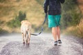 Man with dog in heavy rain