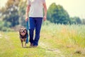 Man with dog going on the field