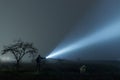 Man and dog searching with flashlight in outdoor Royalty Free Stock Photo