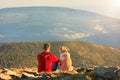 Man with dog on the trip in the mountains Royalty Free Stock Photo