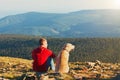 Man with dog on the trip in the mountains Royalty Free Stock Photo