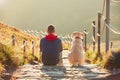 Man with dog on the trip in the mountains Royalty Free Stock Photo