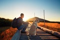 Man with dog on the trip in the mountains