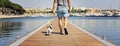 A man with a dog walking on the floating pier