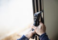 Man doing aluminum frame with glasses and wire screen door and window