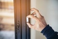 Man doing aluminum frame with glasses and wire screen door and window