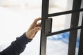 Man doing aluminum frame with glasses and wire screen door and window