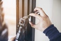 Man doing aluminum frame with glasses and wire screen door and window