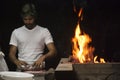 Man doing a barbecue by night Royalty Free Stock Photo