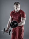 Man doing biceps curl with dumbbells Royalty Free Stock Photo