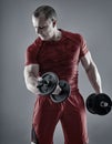 Man doing biceps curl with dumbbells Royalty Free Stock Photo