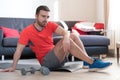 Man doing body exercise and working out at home