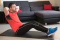 Man doing body exercise and working out at home