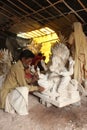 Man doing colour finish of God Ganesha statue, Pune, Maharashtra