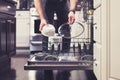 Man doing dishes cleaning in the kitchen household chores