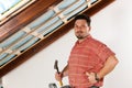 Man doing dry walling, working