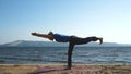 Man doing equilibration exercise at the beach