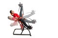 Man doing exercise on inversion table for his back pain, isolated on white. Multiple positions