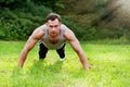 Man doing fitness exercise on the grass