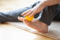 Man doing flatfoot correction self massage at home Royalty Free Stock Photo