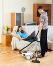 Man doing house cleaning with vaccuum cleaner Royalty Free Stock Photo