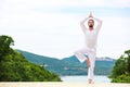 Man Doing Indian classic Yoga at the Sea and Mountains Royalty Free Stock Photo