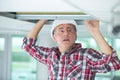 Man doing installation air conditioner and heating duct Royalty Free Stock Photo