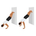 Man doing inverted wall push up exercise