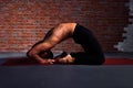 Man doing Kapotasana Royalty Free Stock Photo