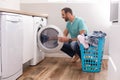 Man doing laundry at home Royalty Free Stock Photo