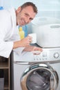 man doing laundry in morning Royalty Free Stock Photo