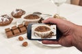 Man doing photo cocoa muffin