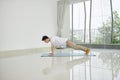 Man doing plank exercise at home - Image