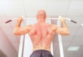 Man doing pull ups with well shaped muscles Royalty Free Stock Photo