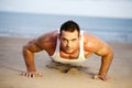 Man doing push ups on a beach Royalty Free Stock Photo