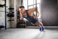 Man doing push-ups on gymnastic rings in gym