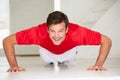 Man doing push-ups in home gym Royalty Free Stock Photo