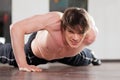 Man doing pushups in gym Royalty Free Stock Photo