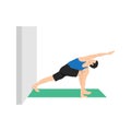 Man doing Revolved side angle pose parivrtta parsvakonasana to the wall Royalty Free Stock Photo