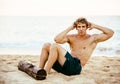 Man Doing Sit-Ups Outdoors on the Beach Royalty Free Stock Photo