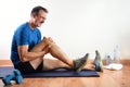 Man doing sport indoors complaining with knee pain Royalty Free Stock Photo