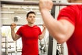 Man doing squats on a smith machine Royalty Free Stock Photo